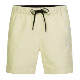 Pantalones cortos de natación de longitud media Tommy con el logotipo de la firma - amarillo - TOMMY HILFIGER *UM0UM02299-ZI9